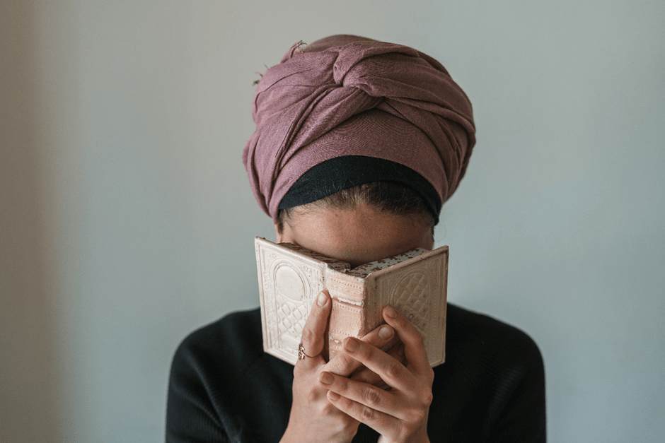 Jewish Woman praying from A siddur